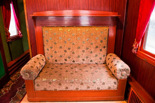 Vintage old sofa in compartment interior