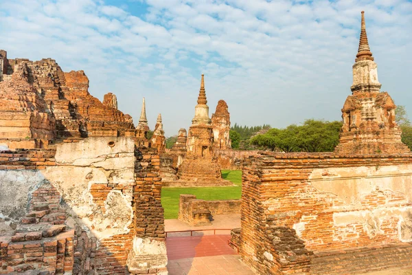 Historical and religious architecture of Thailand - ruins of old Siam capital Ayutthaya. View to brick remains of Wat Mahathat templ