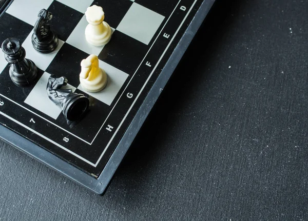 Chess board on dark table — Stock Photo, Image