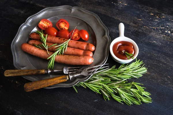 Grilled sausages with rosemary — Stock Photo, Image