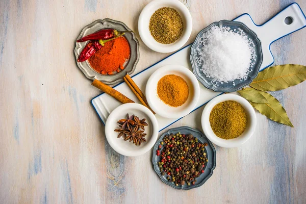 Different spices on white wooden table — Stock Photo, Image