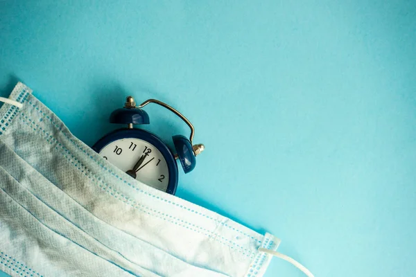 Coronavirus Covid Epidemic Healthcare Concept Face Mask Clock Blue Pastel — Stock Photo, Image