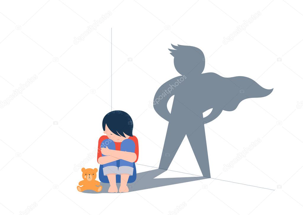 Sad little boy with teddy bear sitting on floor, superhero shadow on the wall. Child abuse, violence against children concept design. 