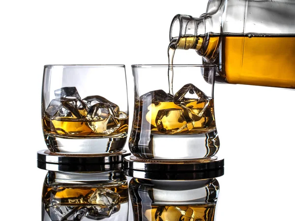 Whisky Being Poured Bottle Glass Ice Cubes White Background — ストック写真