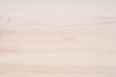 Arkaplan olarak beyaz yumuşak tahta yüzey. 