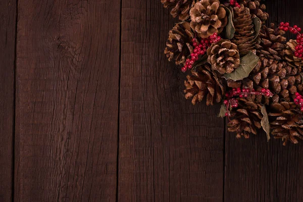 Christmas wreath on a dark wooden background. — Stock Photo, Image