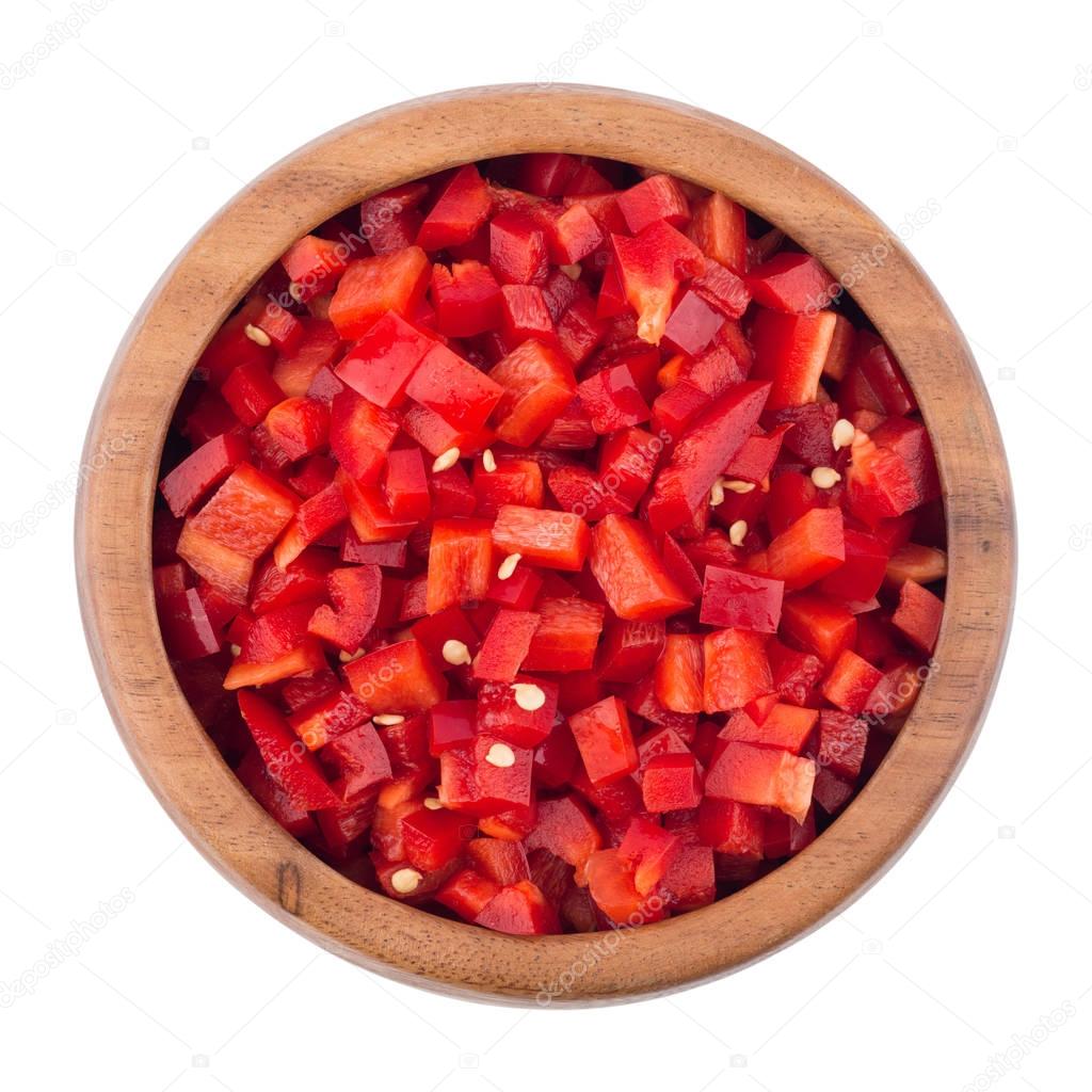 Sliced red pepper in a wooden bowl.