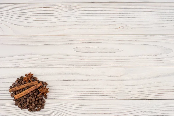 Coffee with cinnamon on old wooden table. — Stock Photo, Image