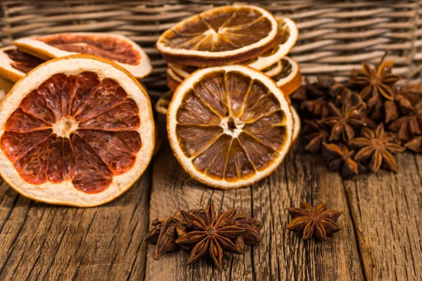 Star anise, oranges and grapefruit on the old wooden table. — Stock Photo, Image