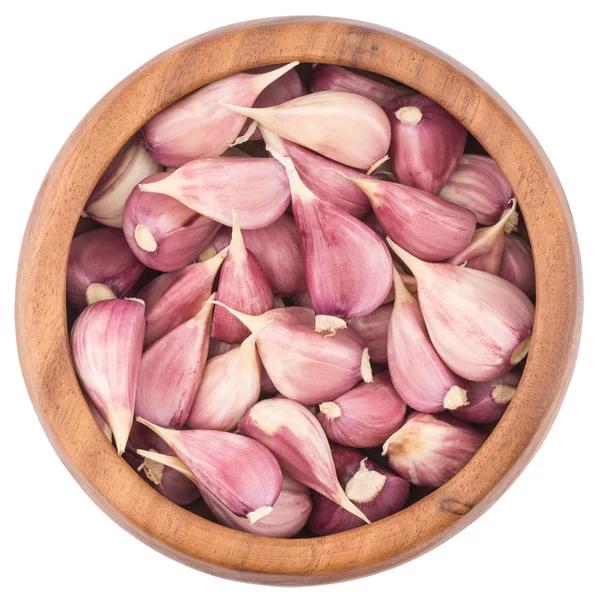 Garlic on wooden bowl top view of white background — Stock Photo, Image