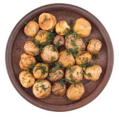 Bir seramik tabak içinde baharatlar ile fırında patates.