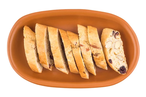 Cookies with raisins and nuts in a ceramic plate. Isolated on wh — Stock Photo, Image