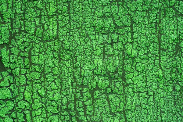 Трещина краски на стене с текстурой — стоковое фото