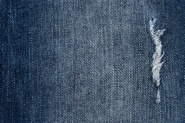 Denim jeans textura ou jeans fundo jeans com rasgado velho. Velho — Fotografia de Stock