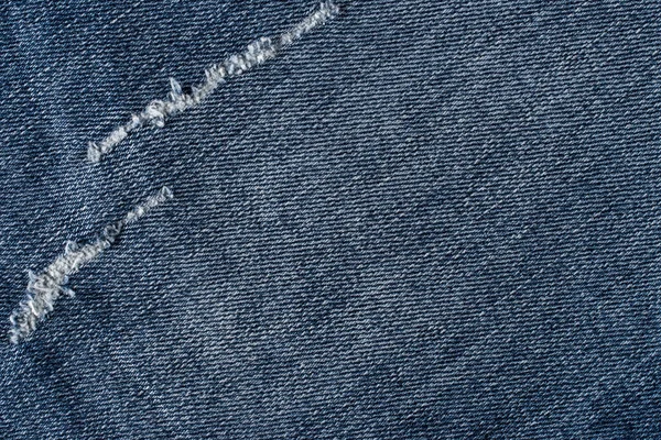 Denim jeans textura ou jeans jeans fundo com rasgado velho . — Fotografia de Stock