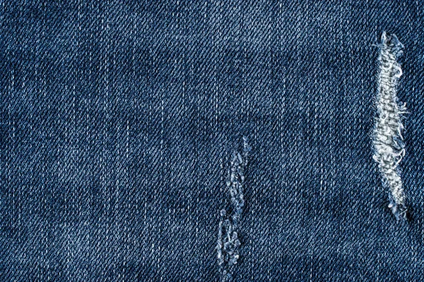 Denim jeans texture or denim jeans background with old torn.