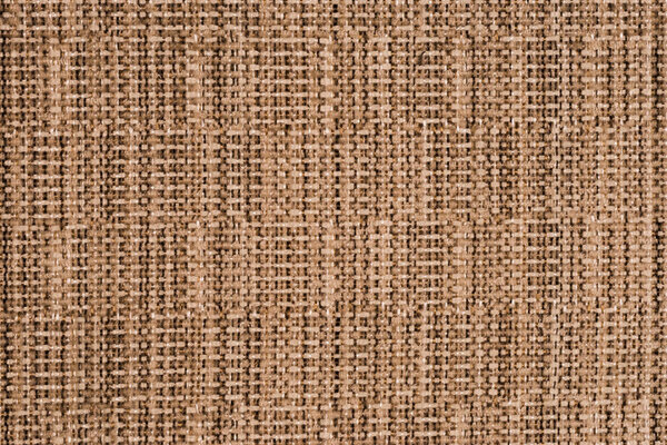 Close up of a woolen fabric of beige color. Abstract background,