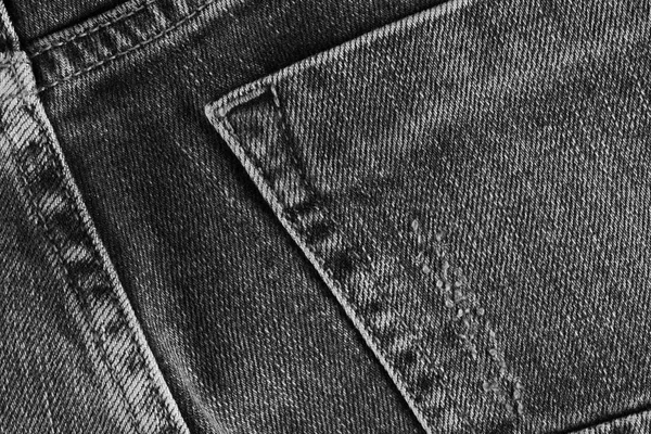 Jeans texture with pocket. Highly detailed closeup of gray denim