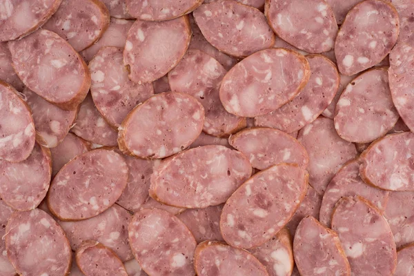 Sliced sausage as background — Stock Photo, Image