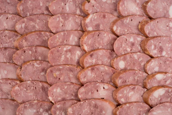 Sliced sausage as background — Stock Photo, Image