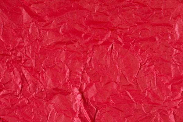 Красный скомканный бумажный фон или текстура в деталях — стоковое фото