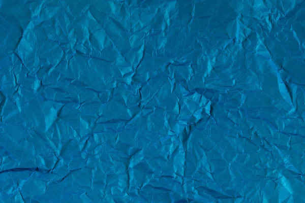Синий фон. Текстура смятой голубой бумаги . — стоковое фото