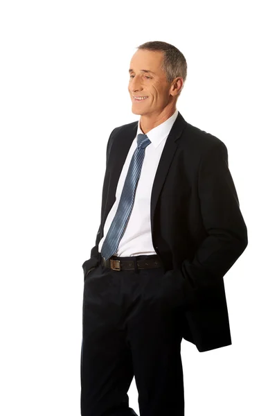 Businessman with hands in pockets — Stock Photo, Image