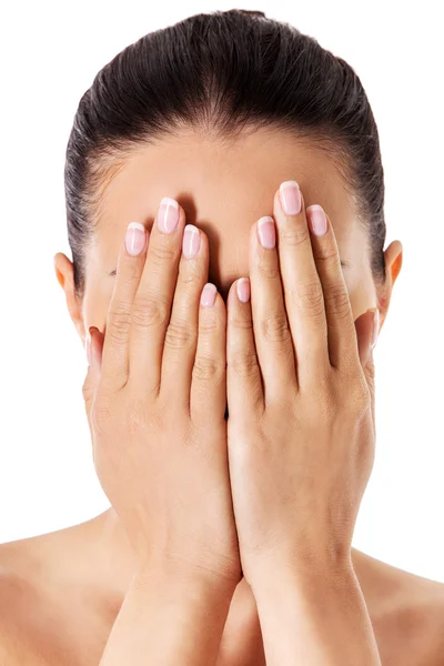 Young woman covering her face with her hands. — Stock Photo, Image