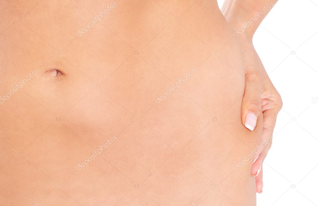 Slim woman pinch skin on hip