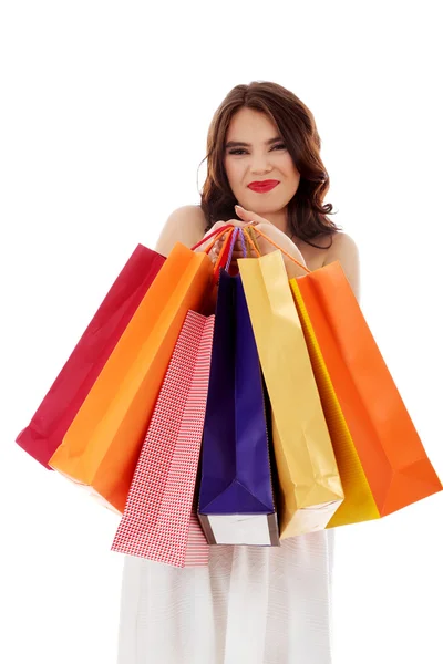Mujer joven sosteniendo pequeñas bolsas de compras vacías —  Fotos de Stock