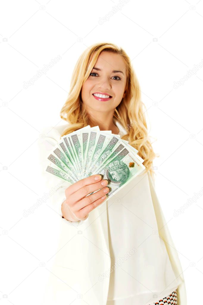 Beautiful casual woman holding money.