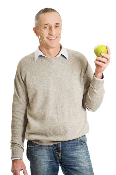 Mature man with an apple — Stock Photo, Image