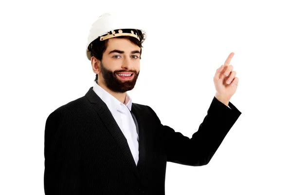 Engineer in protective helmet pointing up. — Stock Photo, Image