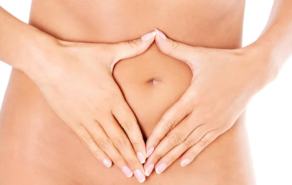 Hands on slim female belly — Stock Photo, Image