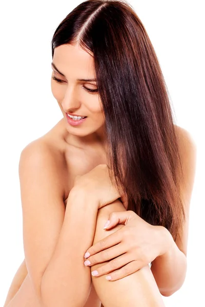 Young nude woman sitting on the floor — Stock Photo, Image