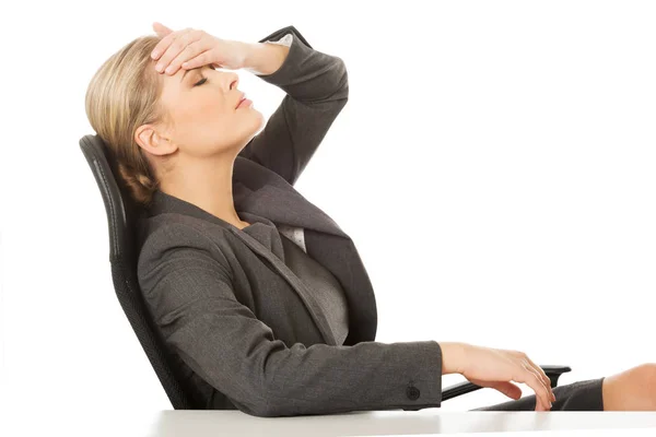 Businesswoman having huge headache — Stock Photo, Image