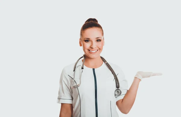 Female doctor presenting copyspace on the right — Stock Photo, Image