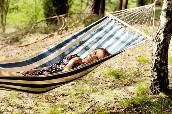 Woman relaxing in the hammock — Stock Photo, Image