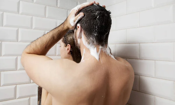 Young couple taking shower. — Stock Photo, Image