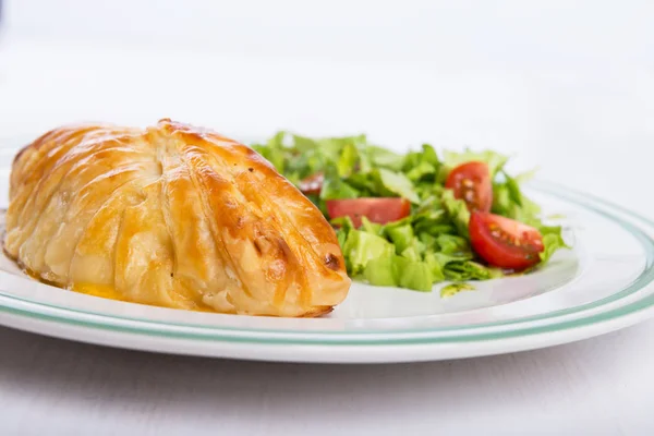 Chicken breast in french pastry with fresh salad — Stock Photo, Image