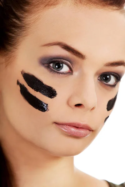 Young military women with war paint on face — Stock Photo, Image