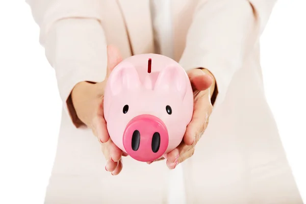 Elderly woman holding piggy bank — Stock Photo, Image