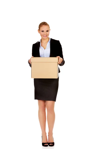 Business woman holding cardboard box — Stock Photo, Image