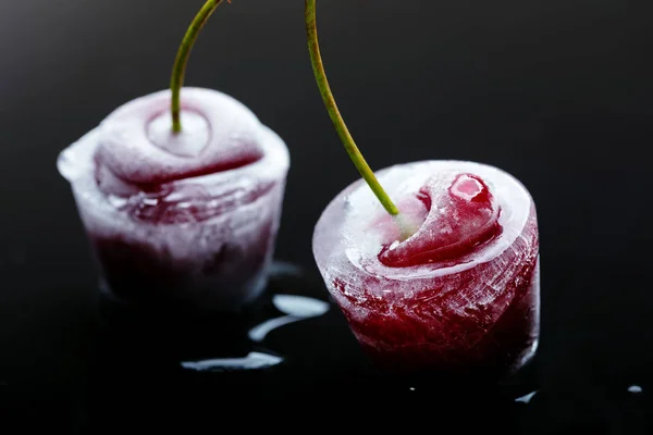 Frozen cherries in ice cubes — Stock Photo, Image