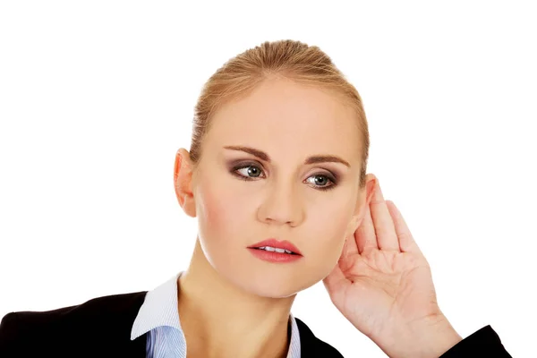 Young business woman overhears a conversation — Stock Photo, Image