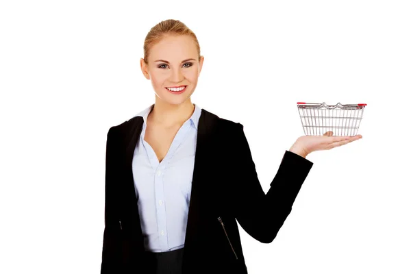 Attractive business woman holding small trolley — Stock Photo, Image