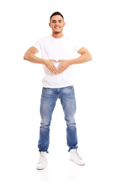 Joven haciendo gesto de corazón — Foto de Stock