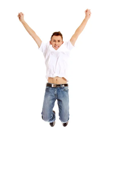 Young guy jumping from happiness — Stock Photo, Image