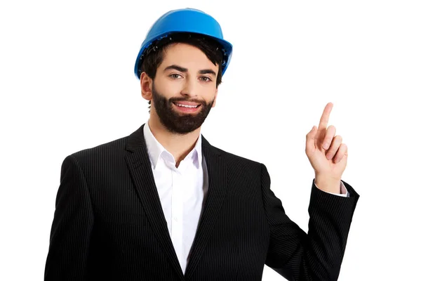 Engineer in protective helmet pointing up. — Stock Photo, Image