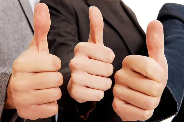 Three business people showing thumbs up — Stock Photo, Image